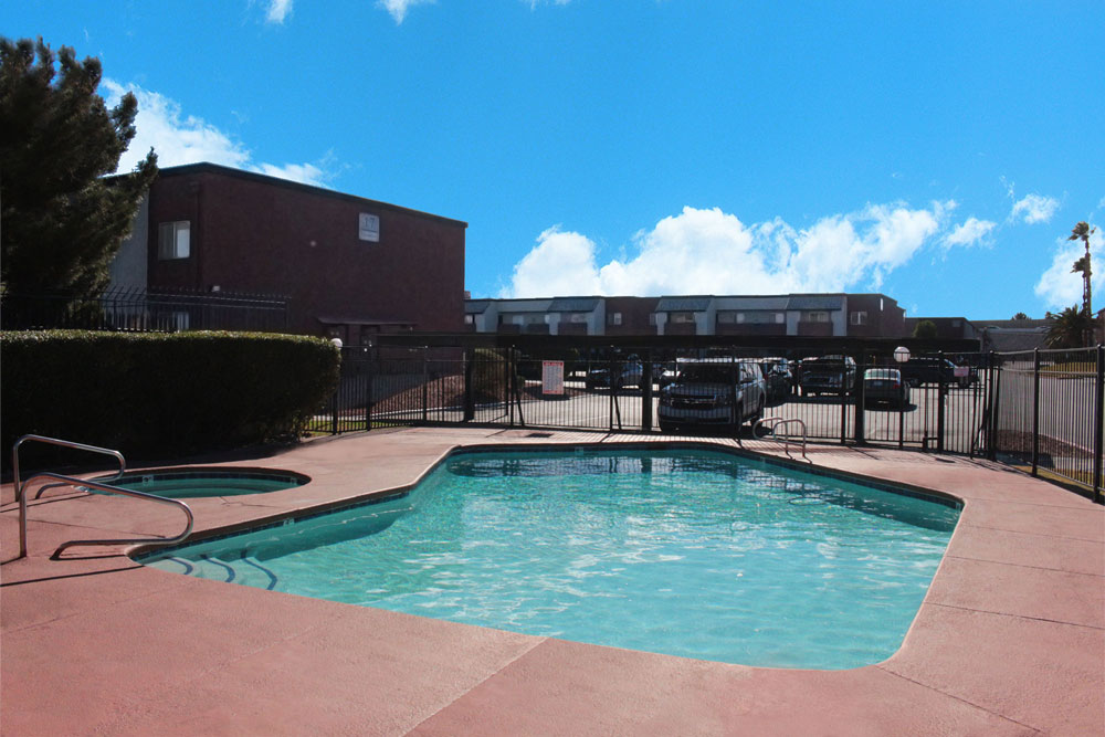 This image displays swimming pool photo of Las Palomas Apartments